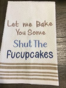 Sassy baking saying embroidered on terry towel.